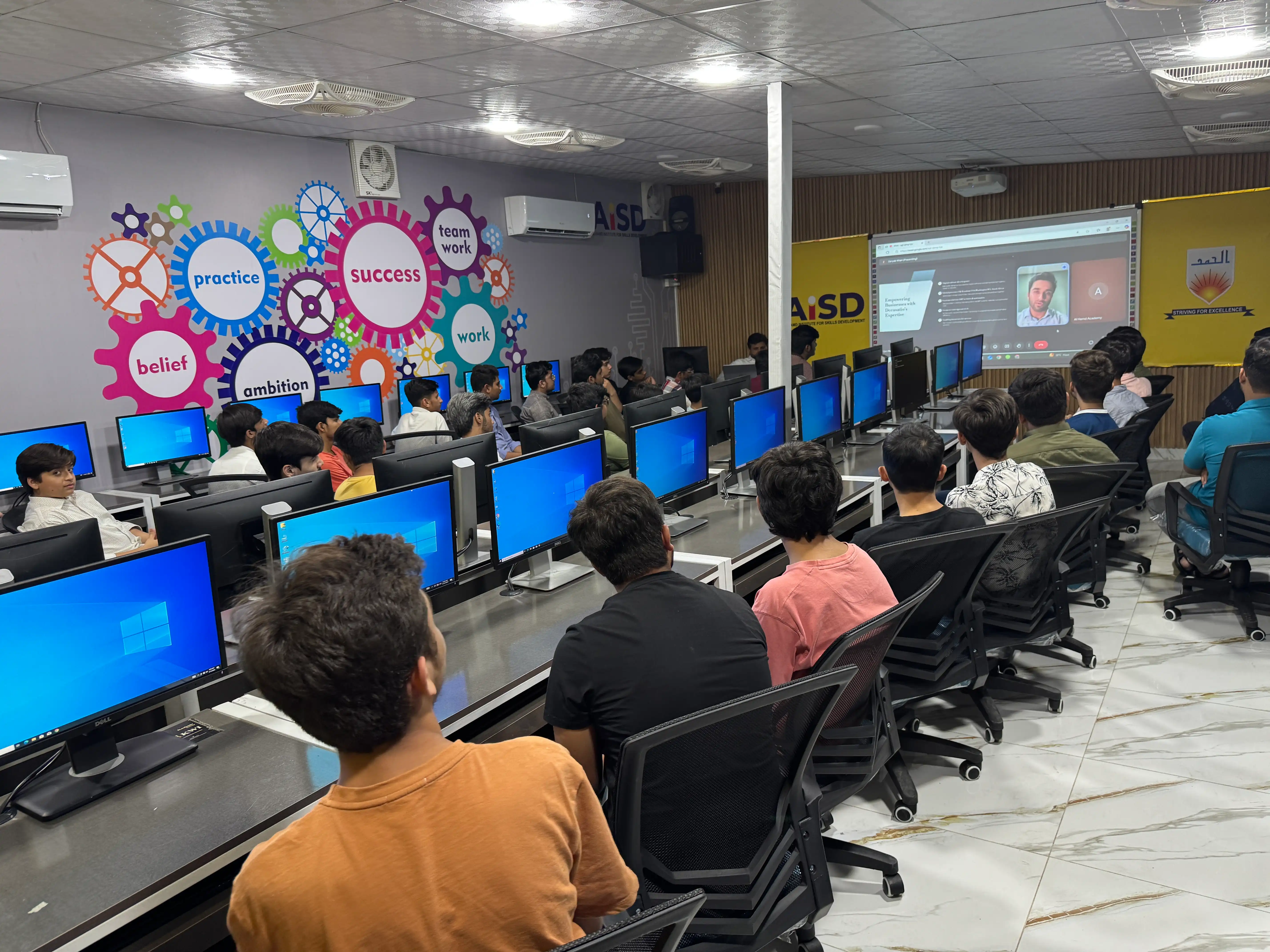 Success and teamwork wall mural in the AISD lab