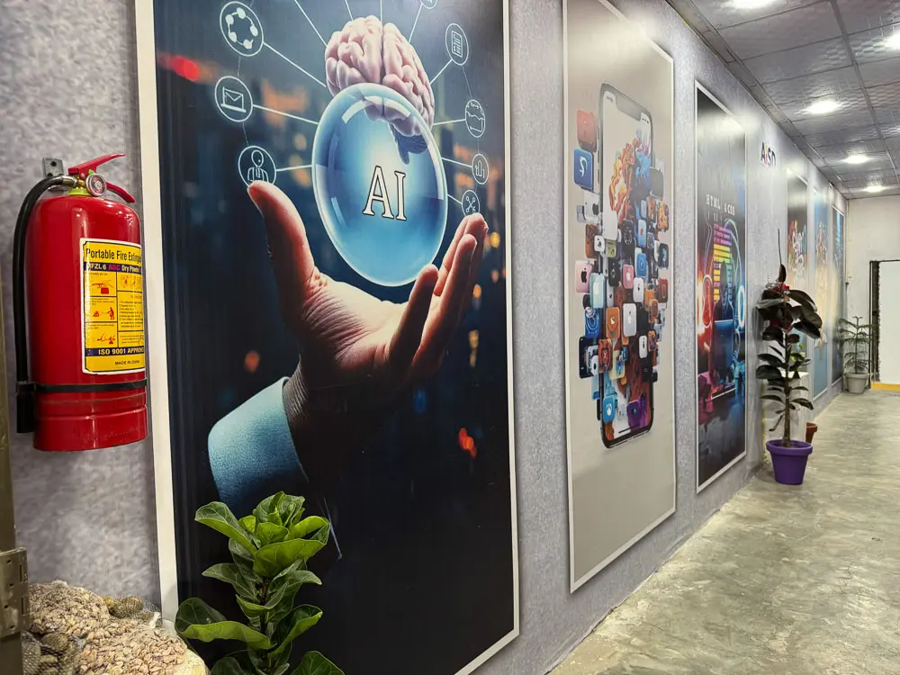 Hallway at AISD institute featuring AI and technology posters leading to the innovation labs